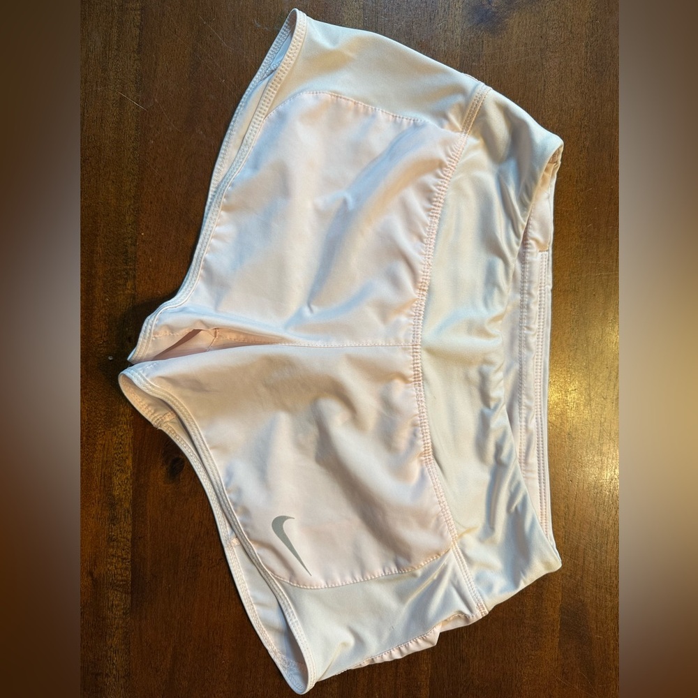 Women’s Nike dri-FIT brief lined shorts, light blush pink, size small